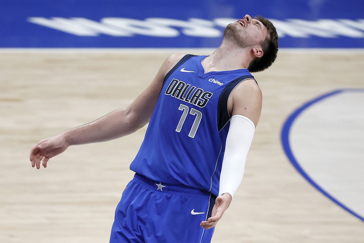 Luka Doncic of the Dallas Mavericks reacts after missing a shot against the San Antonio Spurs in the third quarter at American Airlines Center on April 11, 2021 in Dallas, Texas.