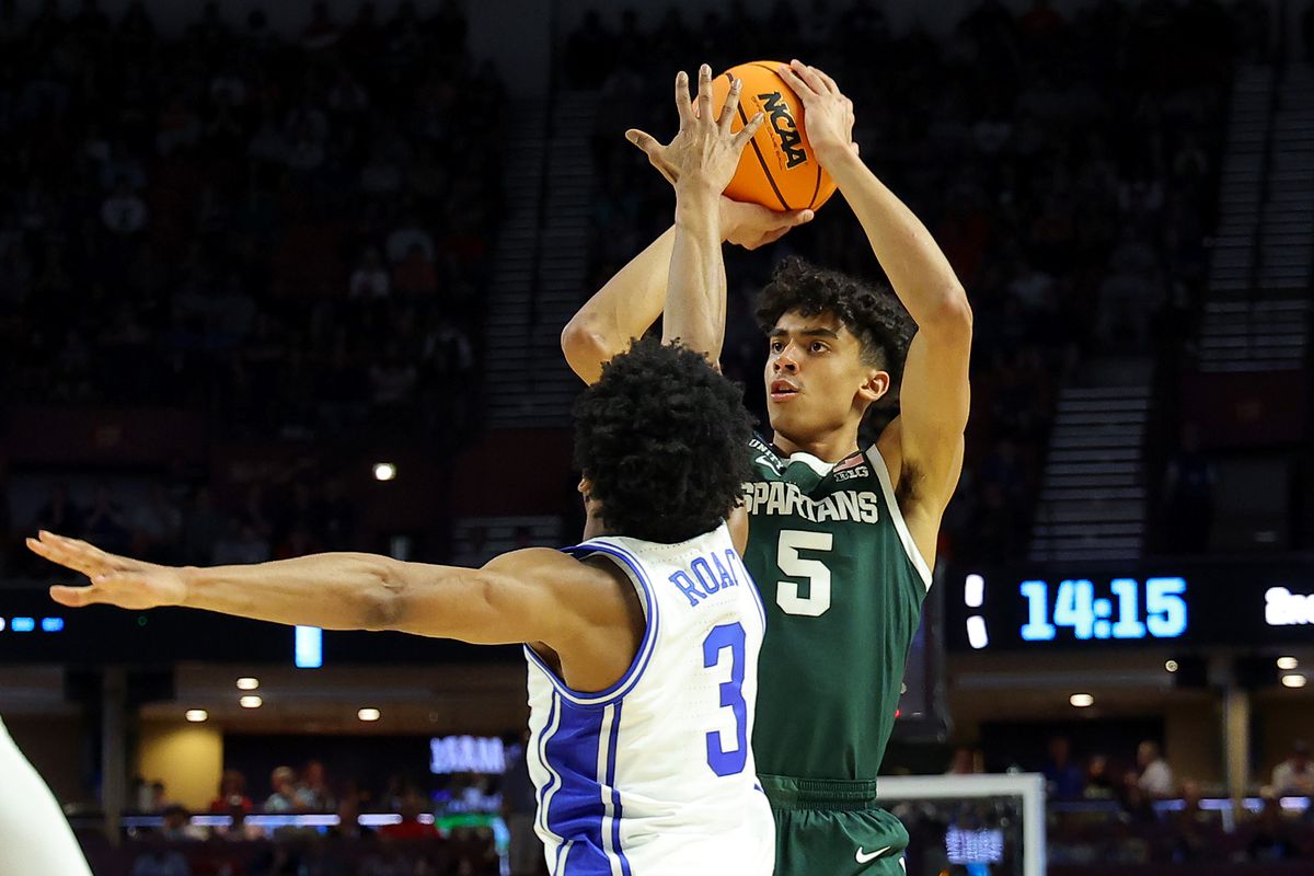 Max Christie #5 of the Michigan State Spartans shoots over Jeremy Roach #3 of the Duke Blue Devils in the second half during the second round of the 2022 NCAA Men’s Basketball Tournament at Bon Secours Wellness Arena on March 20, 2022 in Greenville, South Carolina.