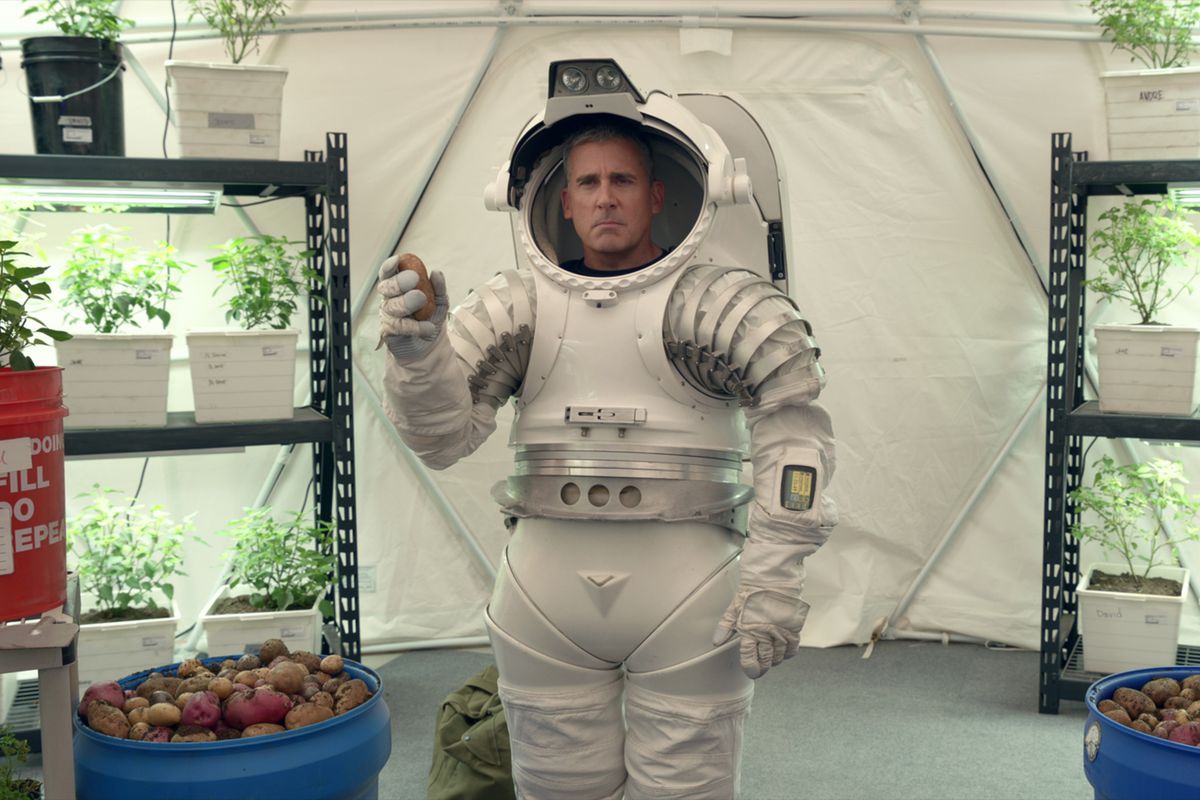 General Naird (Steve Carell) wears a space suit and holds a potato