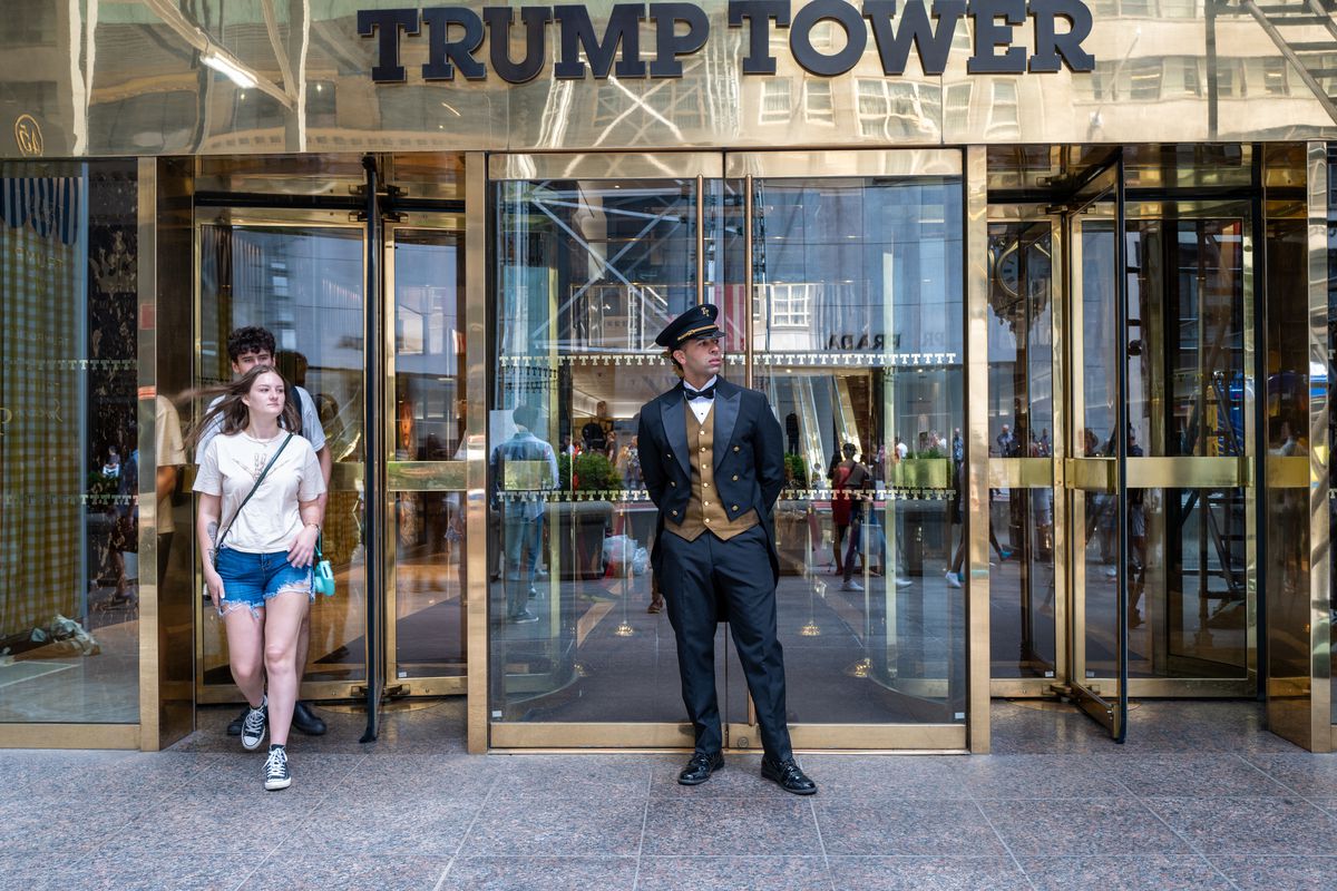 People walk out of Trump Tower in Manhattan on August 10, 2022 in New York City.