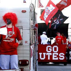 Die-hard Ute fans join the fun during the downtown parade Friday celebrating the University of Utah football team's victory in the Sugar Bowl and unbeaten season.