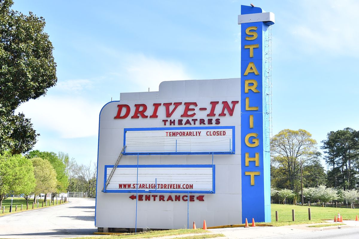 A closed sign at a drive-in movie theater.