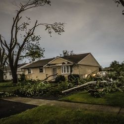 Tornado damage west of Janes Ave. in Woodridge early Monday morning.