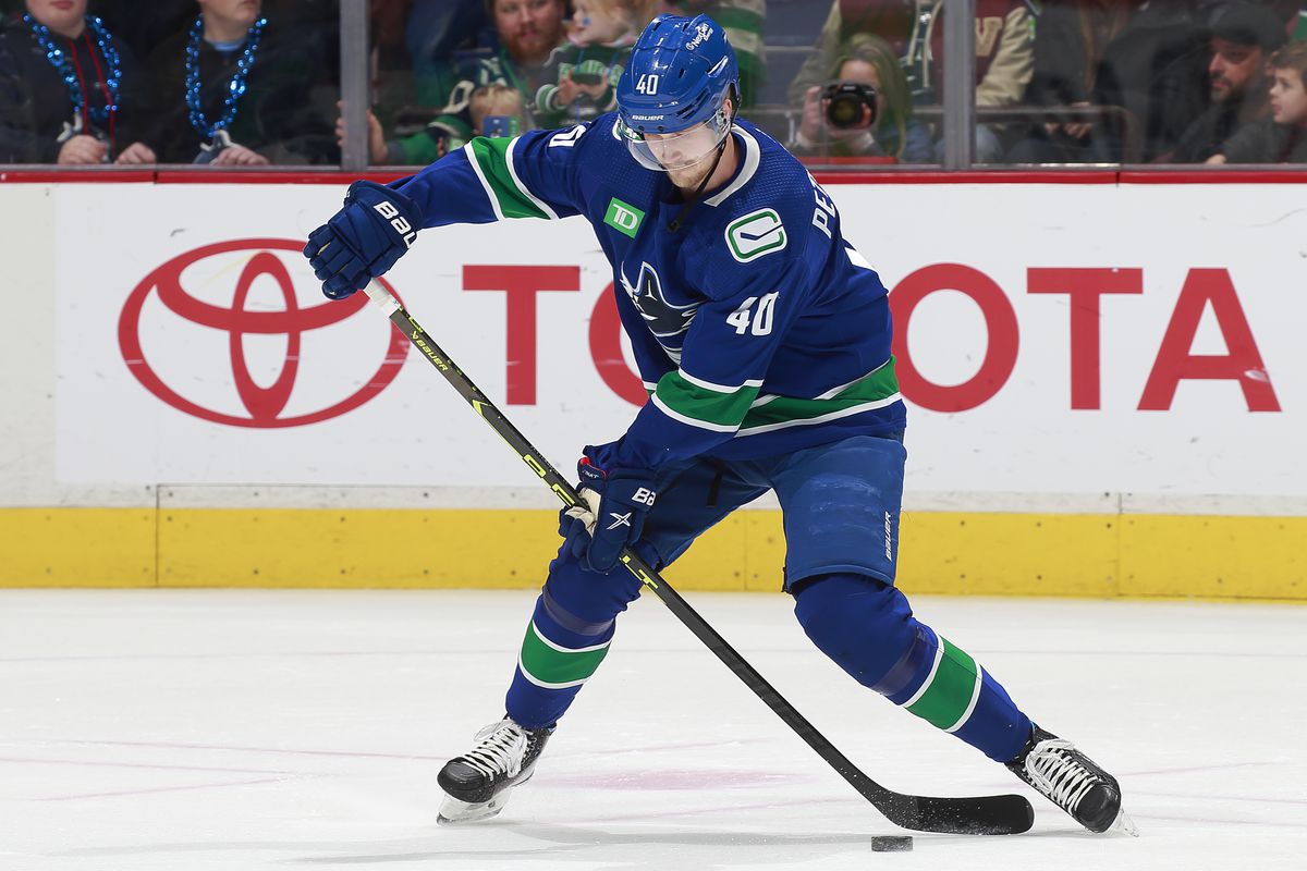 Elias Pettersson #40 of the Vancouver Canucks takes a shot during their NHL game against the Seattle Kraken at Rogers Arena December 22, 2022 in Vancouver, British Columbia, Canada.