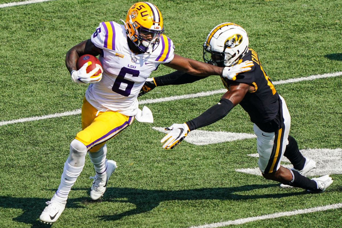 LSU Tigers wide receiver Terrace Marshall Jr. (6) runs against Missouri Tigers defensive back Jaylon Carlies (17) during the second half at Faurot Field at Memorial Stadium.&nbsp;
