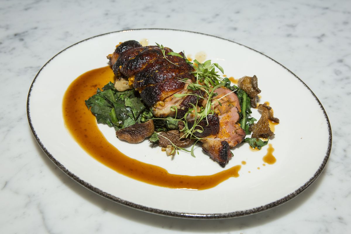 Roasted duck with dandelion greens, and a demi glace 