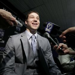 Jimmer Fredette, the Sacramento Kings first round draft pick, the 10th overall, in the NBA draft, held Thursday,  smiles as he talks with reporters at a news conference in Sacramento,  Calif., Saturday, June 25, 2011.  Fredette, a 6-2 guard from BYU, led the nation in scoring with a 28.9 points per game average in 2010-11.