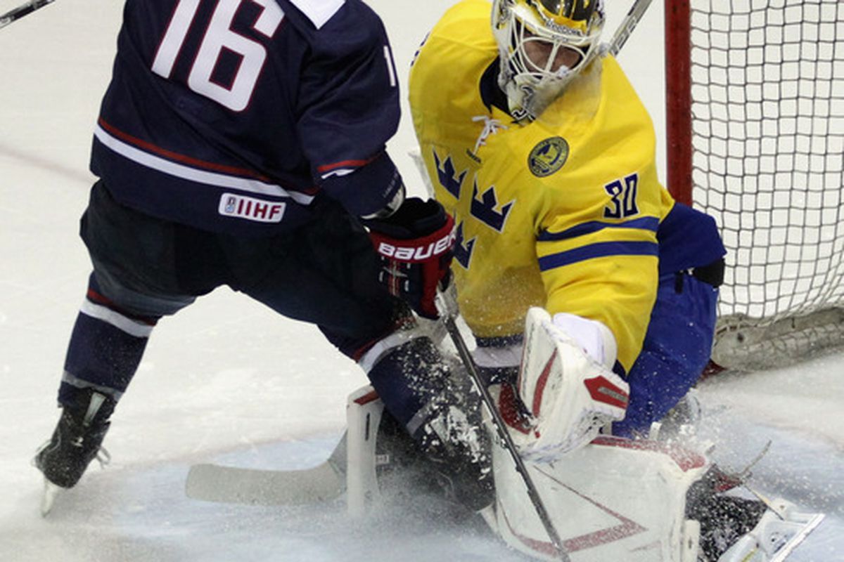 LAKE PLACID, NY - AUGUST 10:  Johan Gustafsson #30 of Team Sweden makes the kick save on Bill Arnold #16 of Team USA at the Lake Placid Olympic Center on August 10, 2011 in Lake Placid, New York.  (Photo by Bruce Bennett/Getty Images)