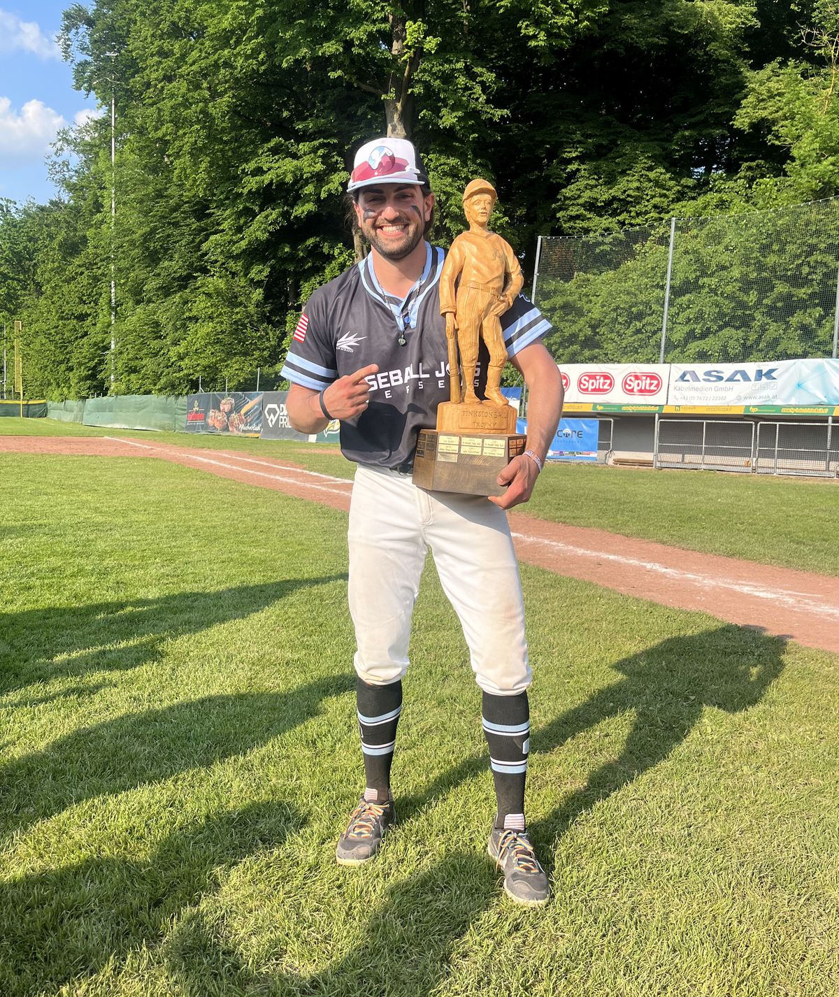 Bryan Ruby proudly holds the trophy after helping the BBJO Globetrotters win Austria’s Finkstonball International Tournament championship.