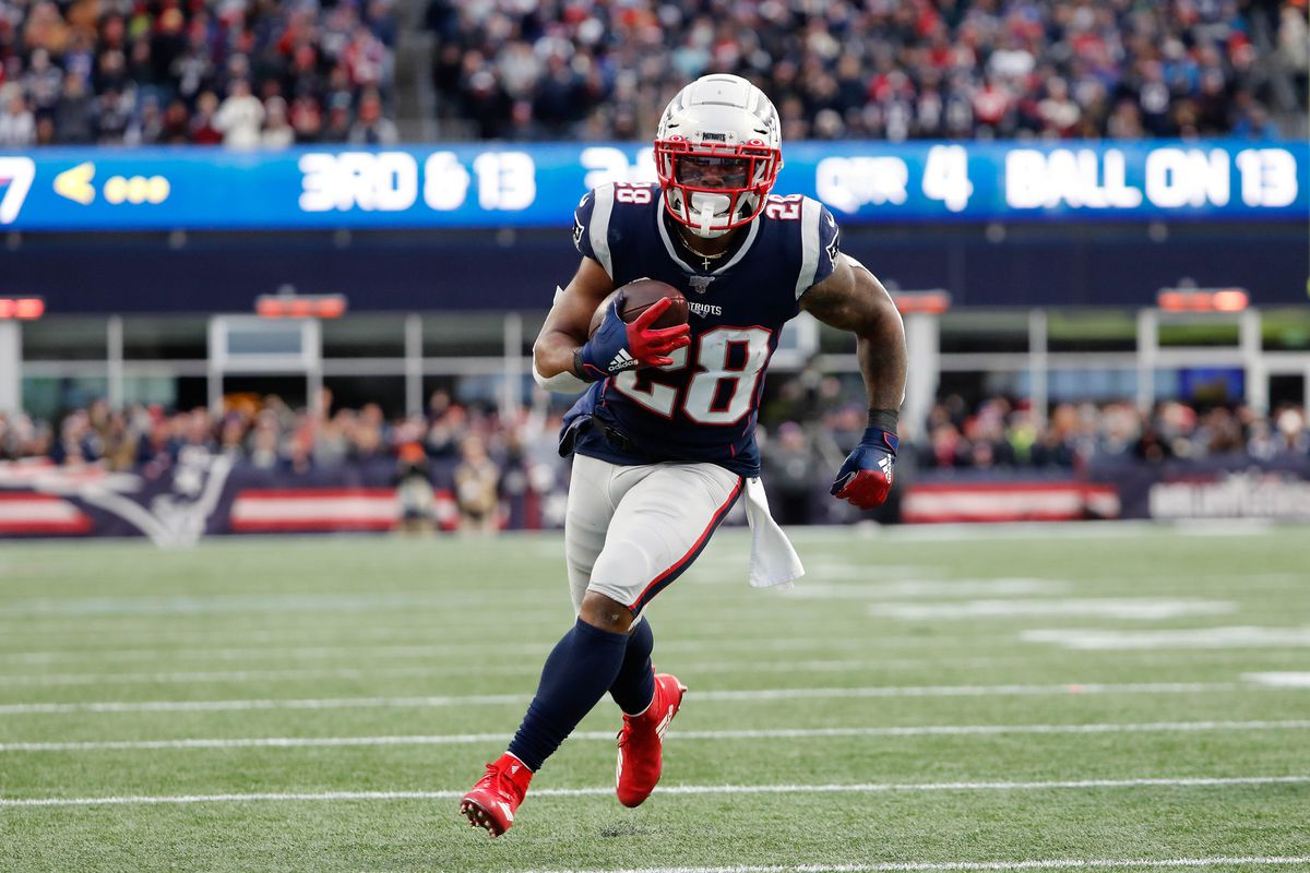 New England Patriots running back James White runs against the Miami Dolphins during the second half at Gillette Stadium.