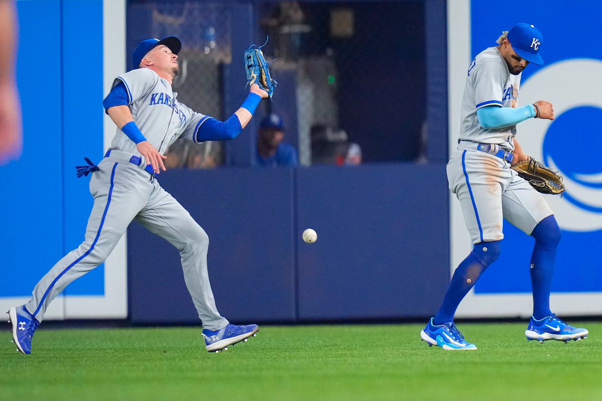 Jun 5, 2023; Miami, Florida, USA; Kansas City Royals center fielder Drew Waters (6) drops a catch as Kansas City Royals right fielder MJ Melendez (1) moves out of the way against the Miami Marlins during the fifth inning at loanDepot Park.