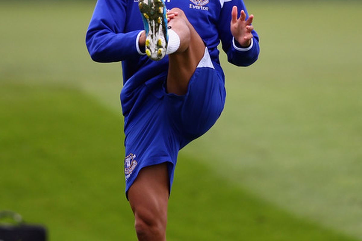 LIVERPOOL, ENGLAND - OCTOBER 21:  Tim Cahill of Everton stretches during an Everton training session at Finch Farm on October 21, 2011 in Liverpool, England.  (Photo by Clive Brunskill/Getty Images)
