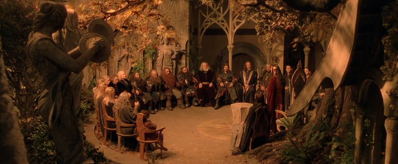 Characters sit in Rivendell for the Council of Elrond in The Fellowship of the Ring.