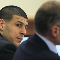 Former NFL football player Aaron Hernandez, left,  and his attorney Charles Rankin listen to testimony during Hernandez' murder trial  at Bristol County Superior Court in Fall River, Mass., Wednesday, Feb. 4, 2015. Hernandez is accused of the June 2013 killing of Odin Lloyd.   