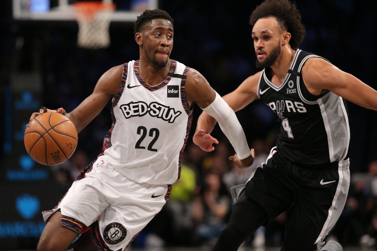 Brooklyn Nets shooting guard Caris LeVert drives the ball around San Antonio Spurs point guard Derrick White during the fourth quarter at Barclays Center.