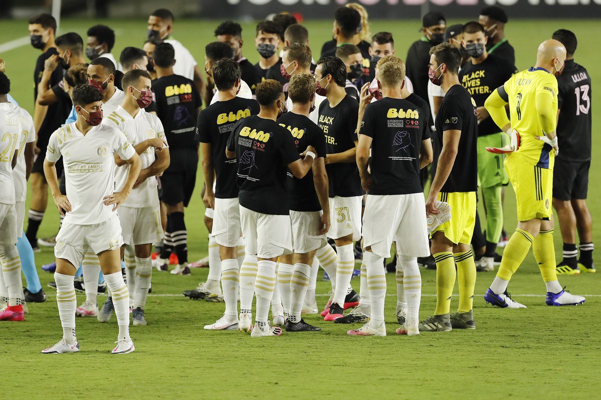 Members of Atlanta United and Inter Miami CF talk at midfield after the game was postponed at Inter Miami CF Stadium on August 26, 2020 in Fort Lauderdale, Florida.
