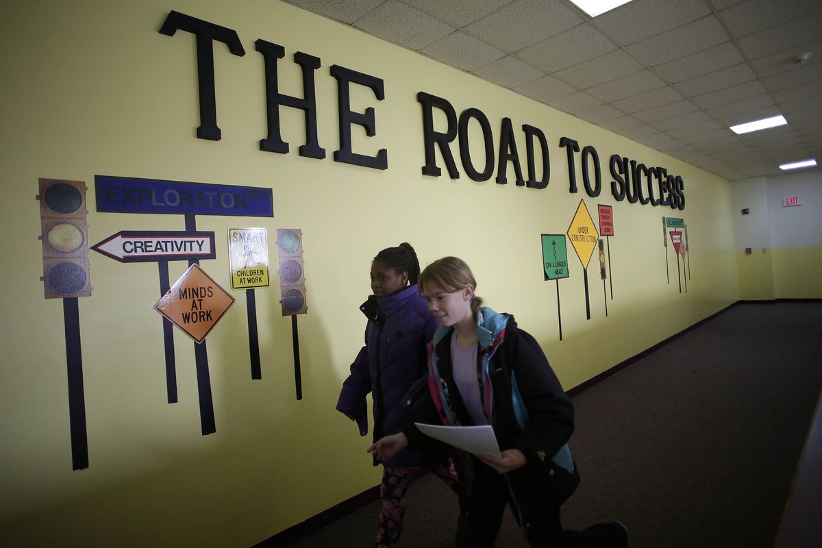 Ft. Wayne, IN: Students walk past "The Road to Success" sign displayed in the hallway at Horizon Christian Academy in Ft. Wayne, Indiana December 20, 2016. Horizon Christian Academy is one of more than 300 schools that accepts vouchers in Indiana, which has the largest statewide voucher program in the nation.