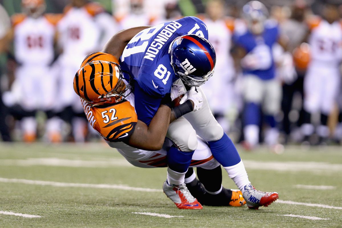 Adrien Robinson is tackled after a catch
