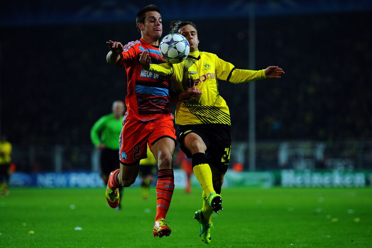 Cesar Azpilicueta of Marseille is challenged by Chris Loewe of Dortmund during the UEFA Champions League group F match on December 6, 2011 in Dortmund, Germany.