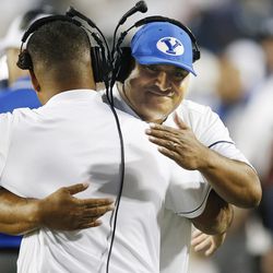 Brigham Young Cougars head coach Kalani Sitake hugs a coach prior to the game with the UCLA Bruins  in Provo on Saturday, Sept. 17, 2016.