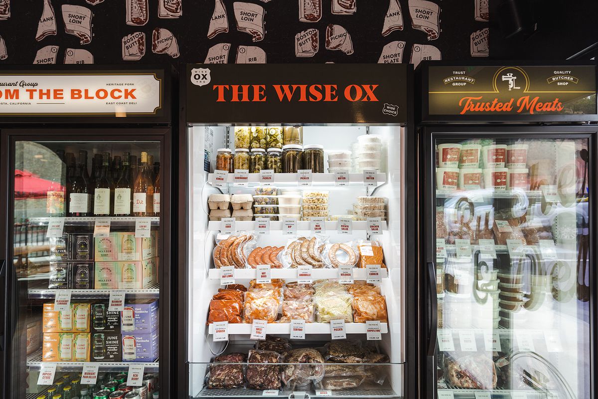Cases of meat and other products at a butcher shop.