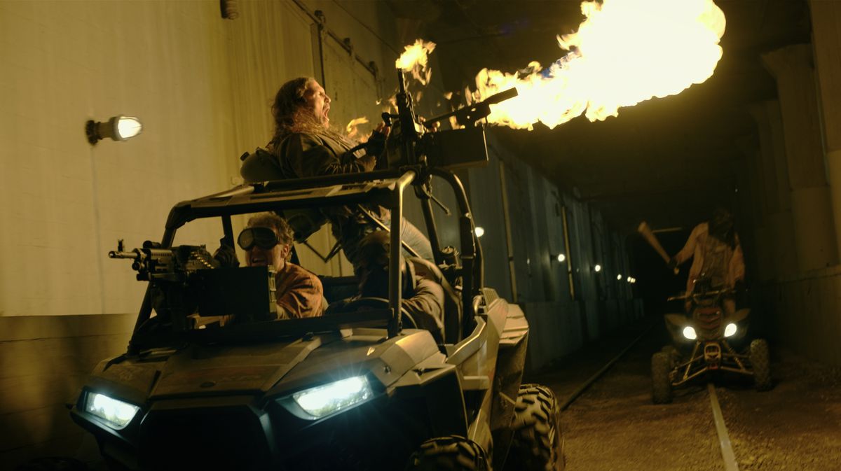 Purgers fire a machine gun atop a buggy in The Forever Purge