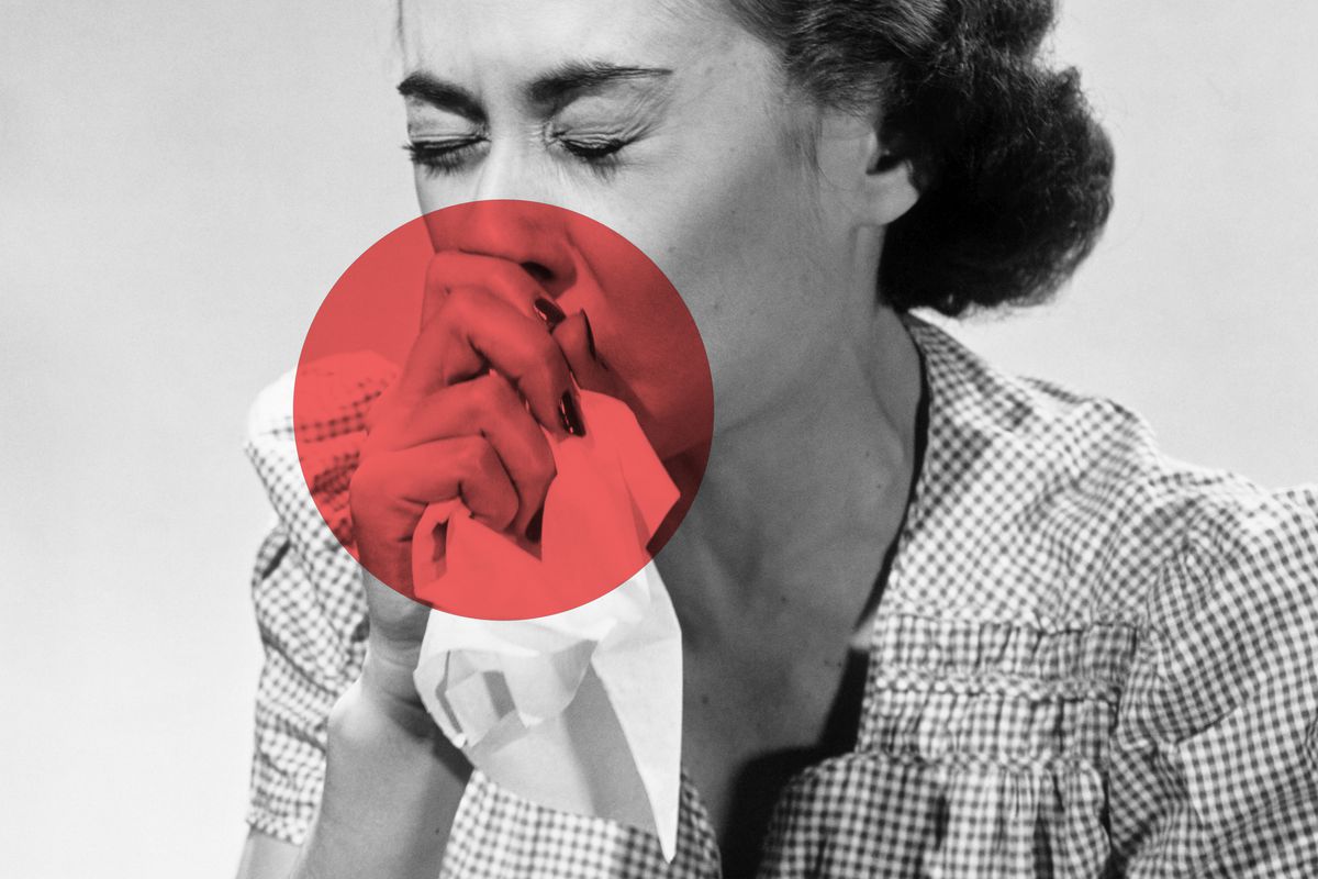 A black-and-white photo of a woman blowing her nose with a red circle around the nose, mouth, and tissue.