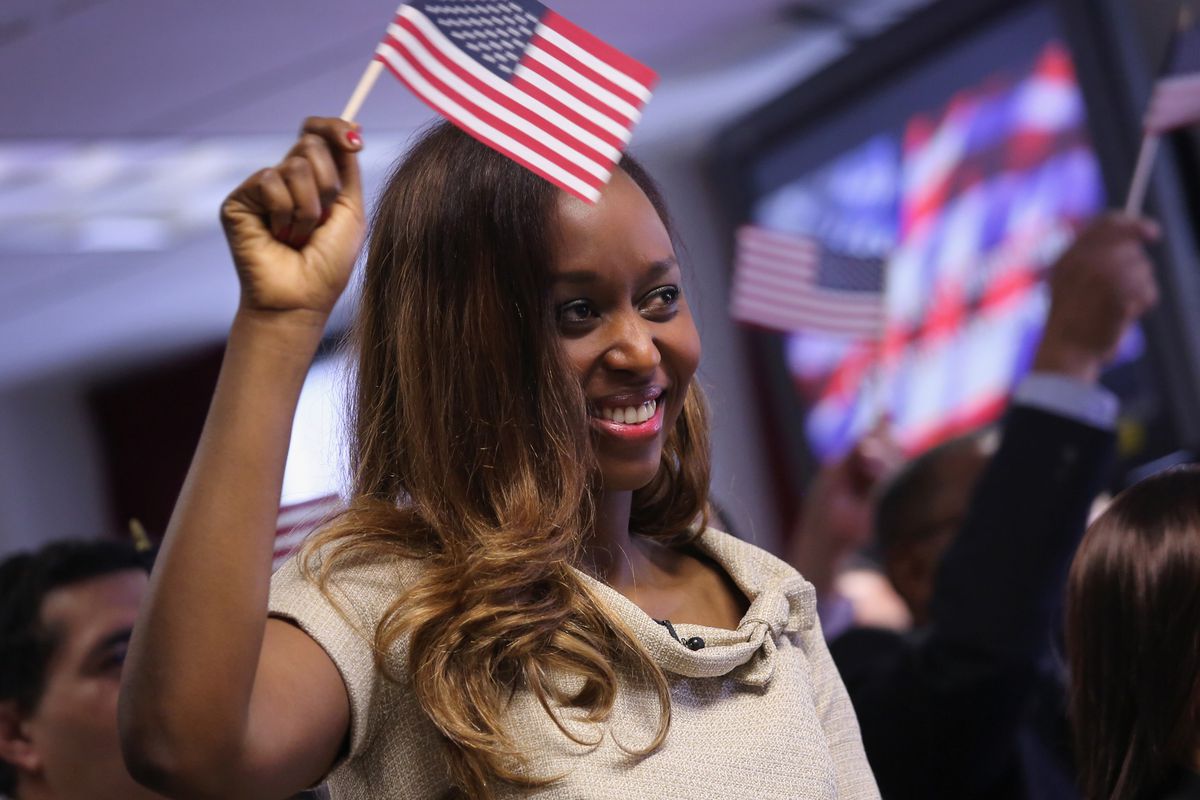 A Rwandan immigrant gets her US citizenship.