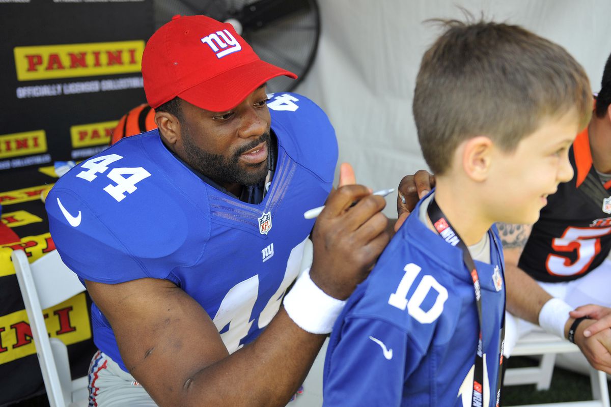 Andre Williams signs an autograph Saturday at the NFLPA Rookie Premiere