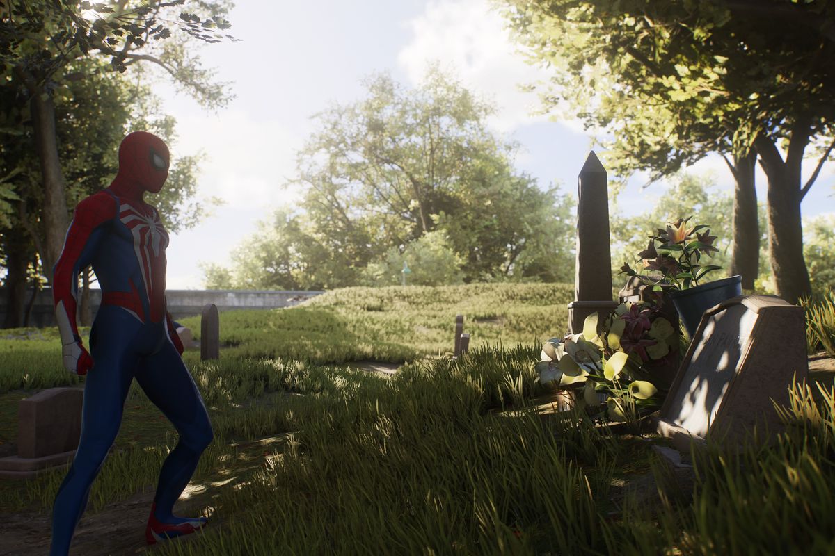 Peter Parker stands in front of a tombstone in Marvel’s Spider-Man 2