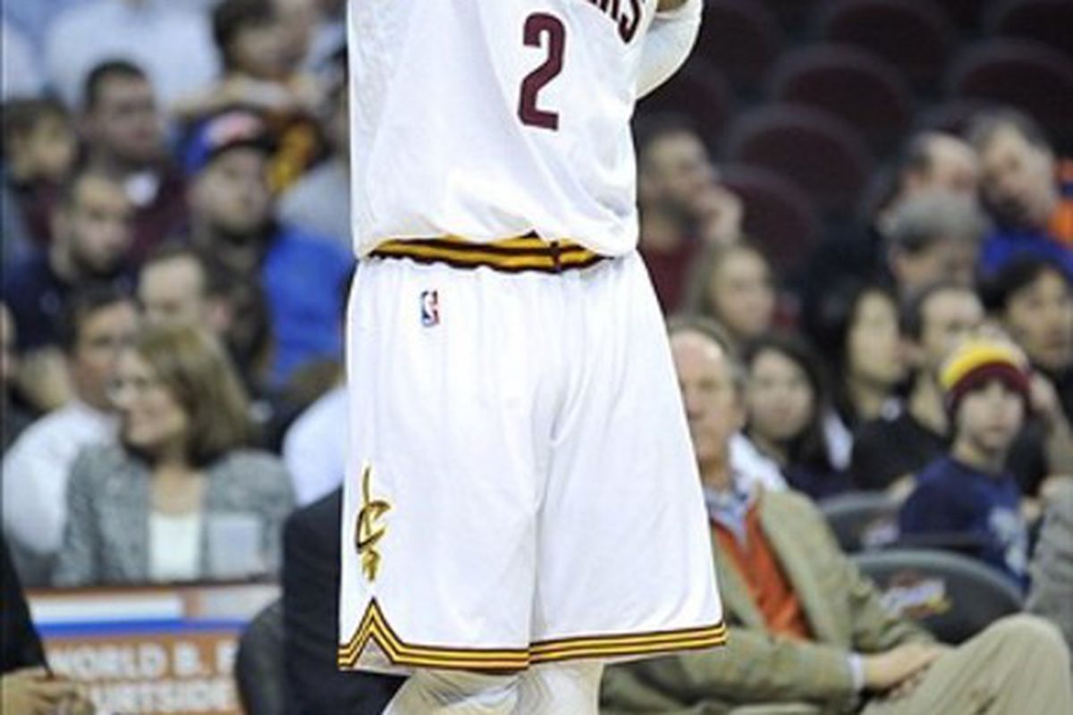 Mar 5, 2012; Cleveland, OH, USA; Cleveland Cavaliers point guard Kyrie Irving (2) holds his head while looking at the scoreboard in the fourth quarter against the Utah Jazz at Quicken Loans Arena. Mandatory Credit: David Richard-US PRESSWIRE