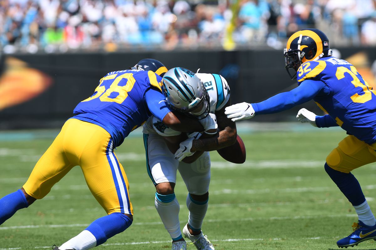 Los Angeles Rams ILB Cory Littleton punches the ball out from Carolina Panthers WR D.J. Moore in Week 1, Sep. 8, 2019.