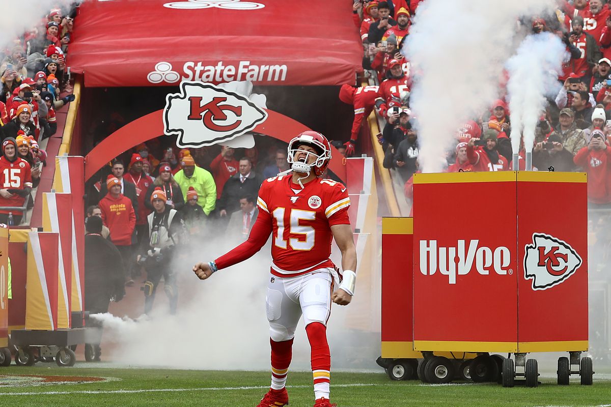 Quarterback Patrick Mahomes #15 of the Kansas City Chiefs runs out of the tunnel as he is introduced prior to the game against the Los Angeles Chargers at Arrowhead Stadium on December 29, 2019 in Kansas City, Missouri.