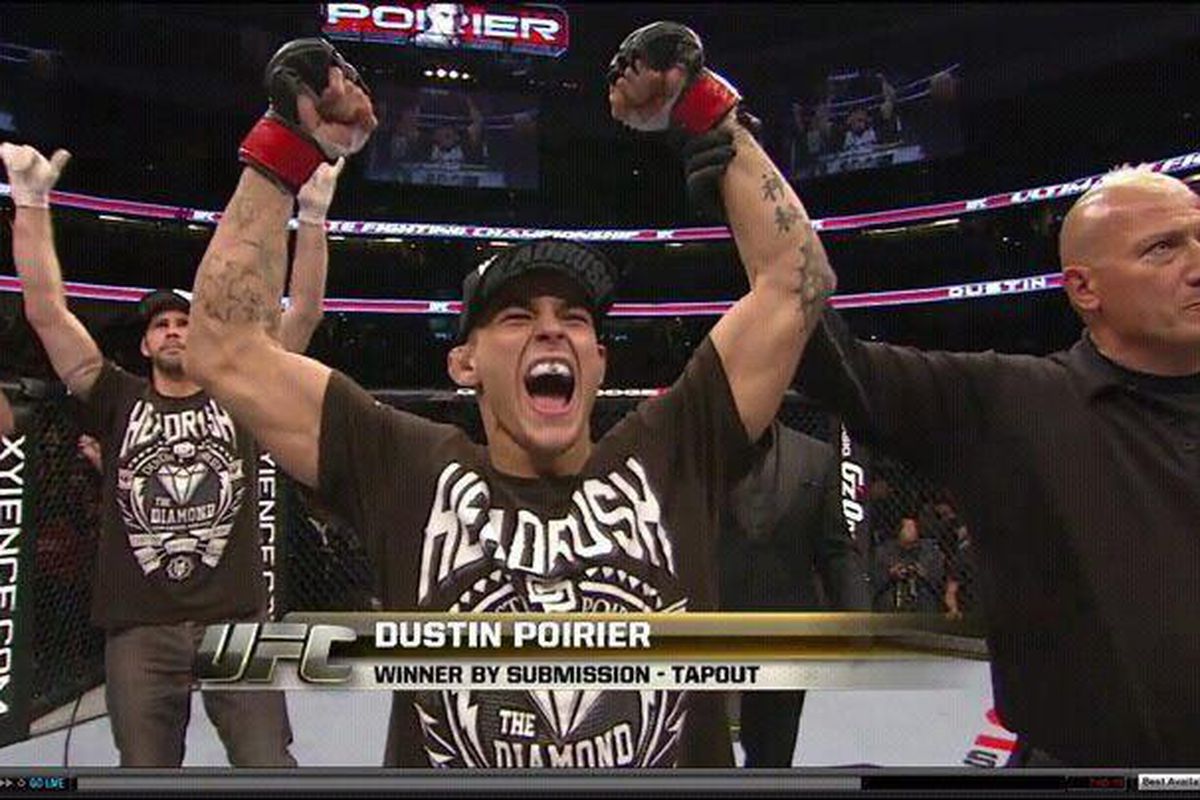 Tim Credeur (left) celebrates after his student Dustin Poirier (right) is pronounced the winner of his UFC on FOX fight against Pablo Garza last November.