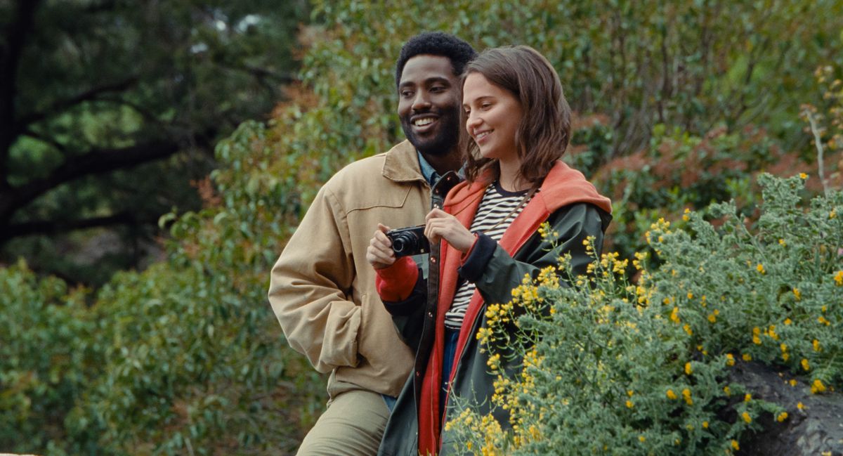 John David Washington and Alicia Vikander as happy, doomed tourists in the opening of Netflix’s Beckett