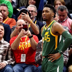 Fans take photos of Utah Jazz guard Donovan Mitchell (45) as the Utah Jazz and the Los Angeles Clippers play at Vivint Smart Home Arena in Salt Lake City on Wednesday, Feb. 27, 2019.