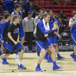 The Vikings celebrate following Pleasant Grove's 57-42 victory against the Copper Hills Grizzlies in the Class 6A state semifinals at the Jon M. Huntsman Center in Salt Lake City on Friday, March 2, 2018.