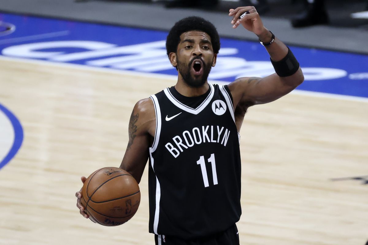 Brooklyn Nets guard Kyrie Irving reacts during the third quarter against the Dallas Mavericks at American Airlines Center.