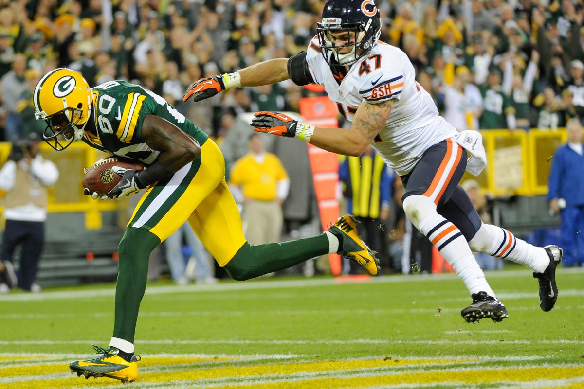 Sept 13, 2012; Green Bay, WI, USA;   Green Bay Packers wide receiver Donald Driver (80) grabs a touchdown pass in front of Chicago Bears safety Chris Conte (47) in the fourth quarter at Lambeau Field.  Mandatory Credit: Benny Sieu-US PRESSWIRE