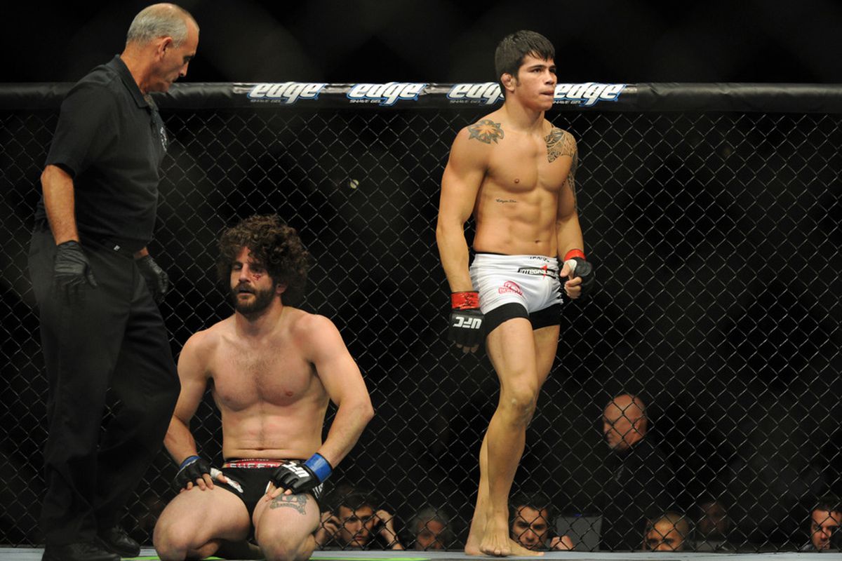 June 8, 2012; Sunrise, FL, USA; Erick SIlva (right) reacts to beating Charlie Brenneman at the end of their UFC bout at BankAtlantic Center. Mandatory Credit: Steve Mitchell-US PRESSWIRE
