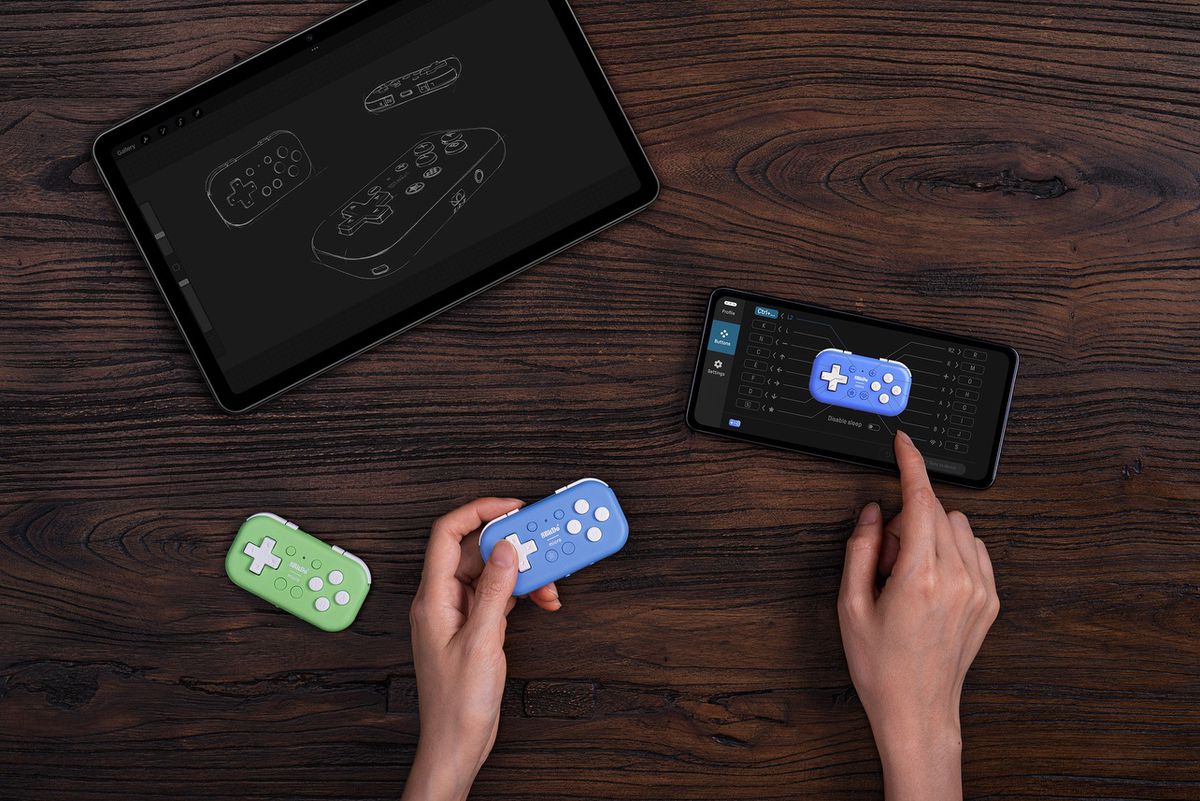 A stock photo of the 8BitDo Micro controller being reprogrammed using the 8BitDo Ultimate Software on Android.