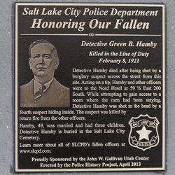 A plaque is placed at the Gallivan Center in memory of detective Green B. Hamby, who was killed 92 years ago while tracking down a burglary suspect, Monday, April 29, 2013, in Salt Lake City.