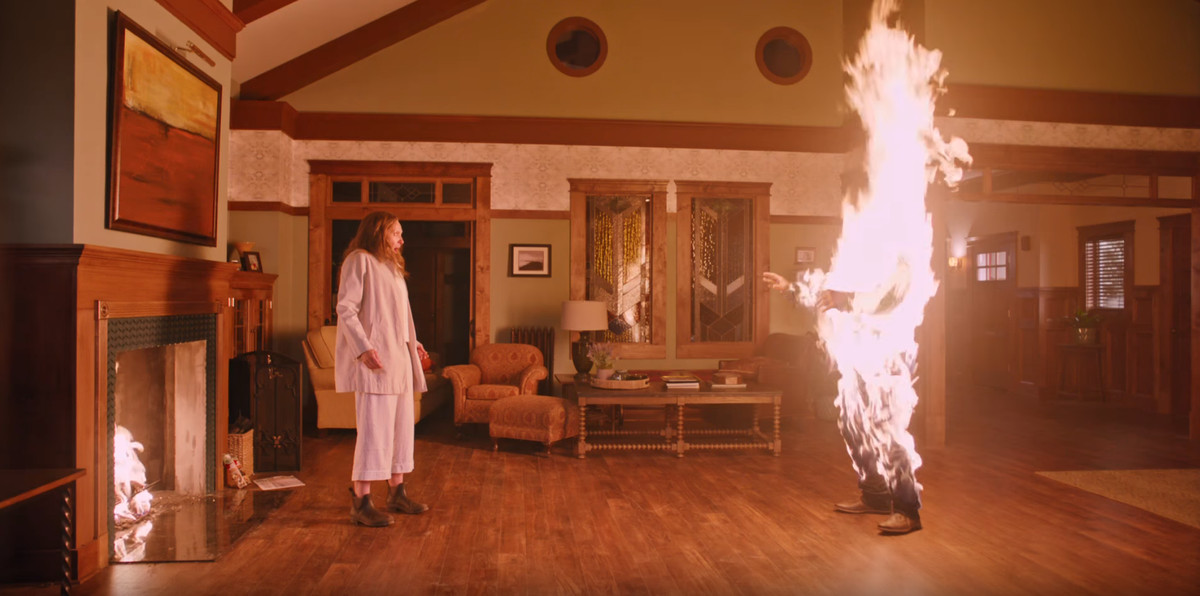 Toni Collette in Hereditary with a burning figure