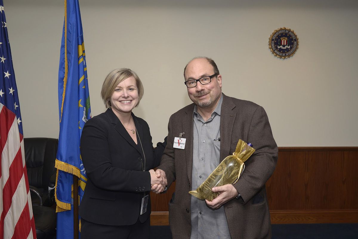 Newmark accepting an award from FBI Assistant Special Agent in Charge Lisa Gentilcore in 2015, for Craigslists’s help in combating human trafficking. (Courtesy Craig Newmark)