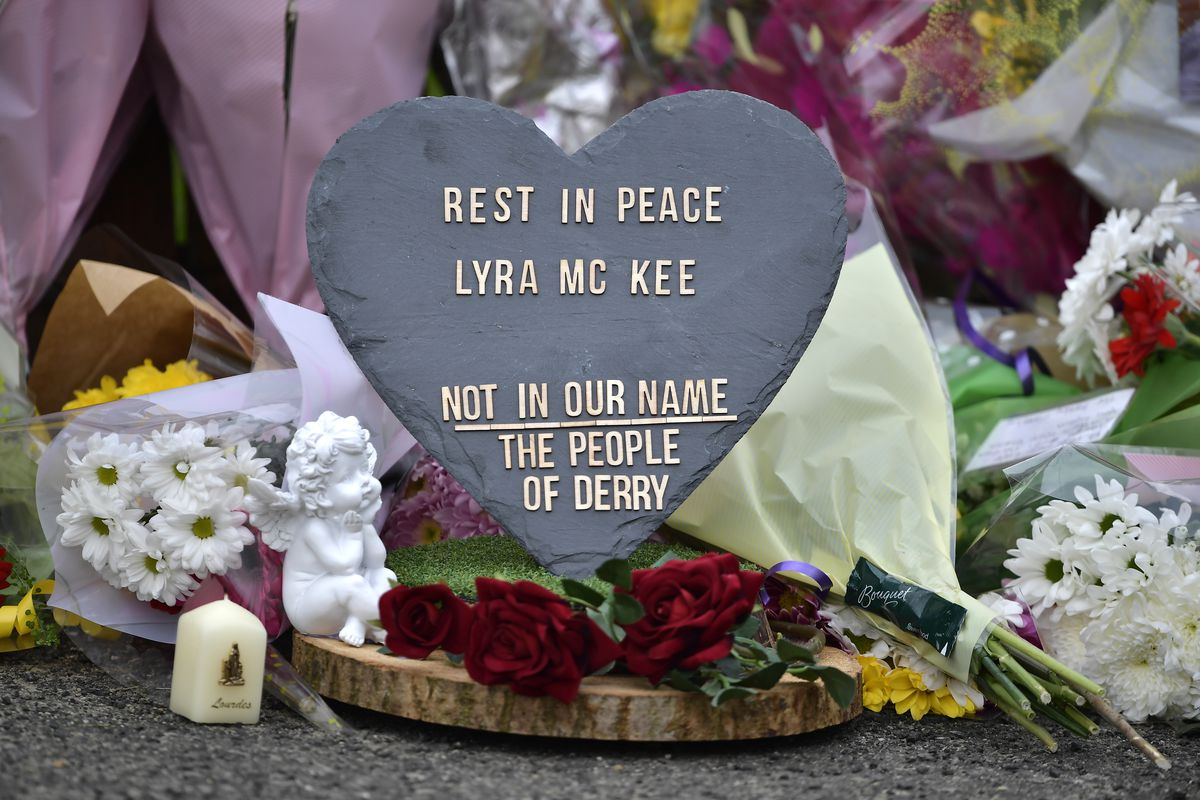 A paper heart and flowers at a memorial to journalist Lyra McKee, who was shot during rioting in Northern Ireland.
