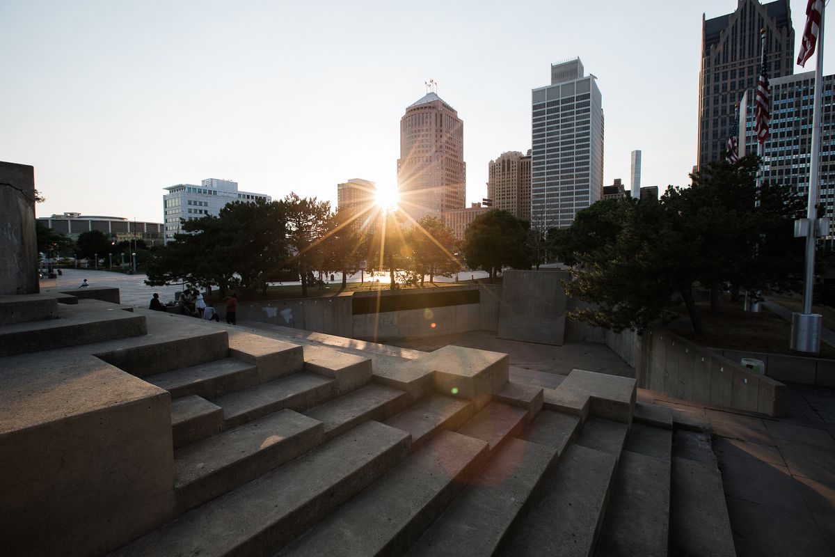 Long rows of concrete stairs and benches rise from a concrete amphitheater.