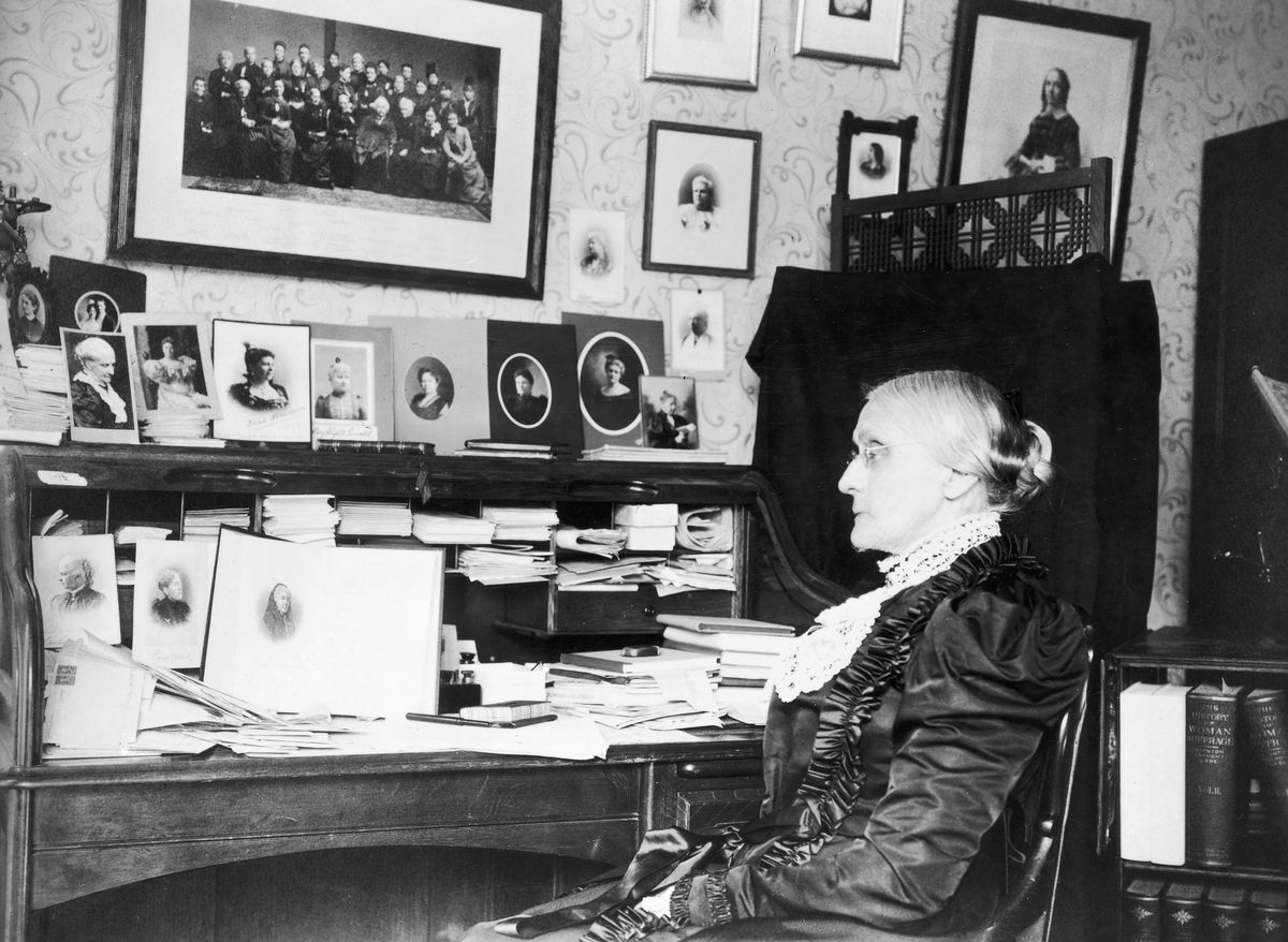 Susan B. Anthony sitting at her desk, circa 1868.