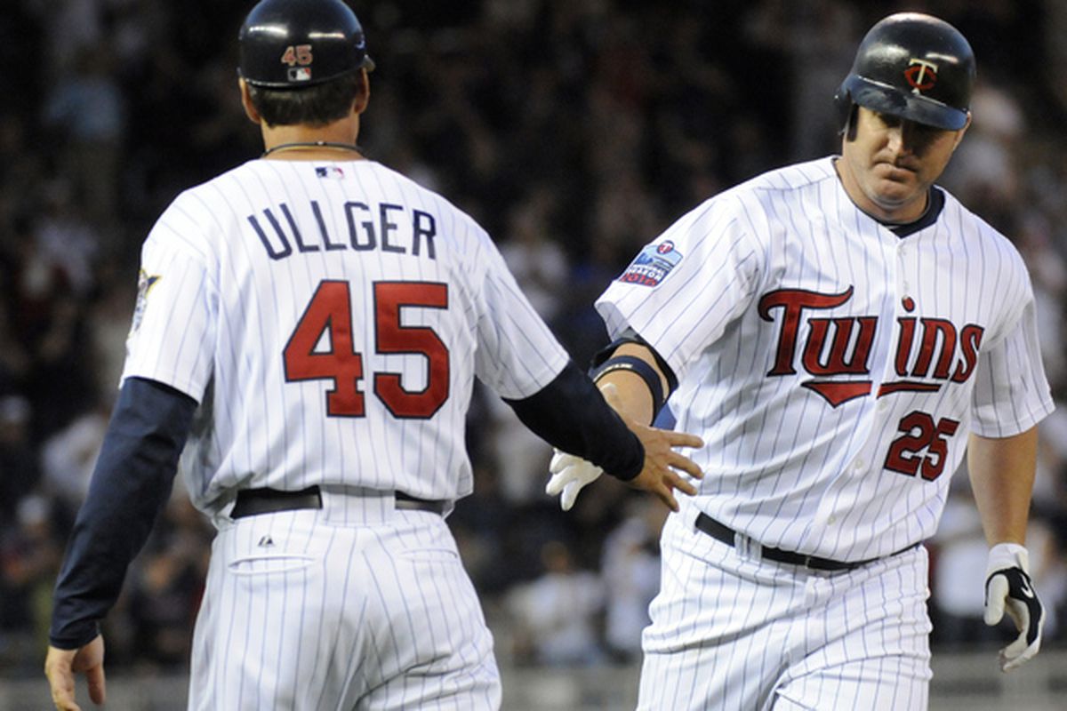 This is a picture of Jim Thome being congratulated by Minnesota Twins bench base coach Scott Ullger after mashing a tater.  June 28, 2010 at Target Field in Minneapolis, Minnesota.  (Photo by Hannah Foslien/Getty Images)