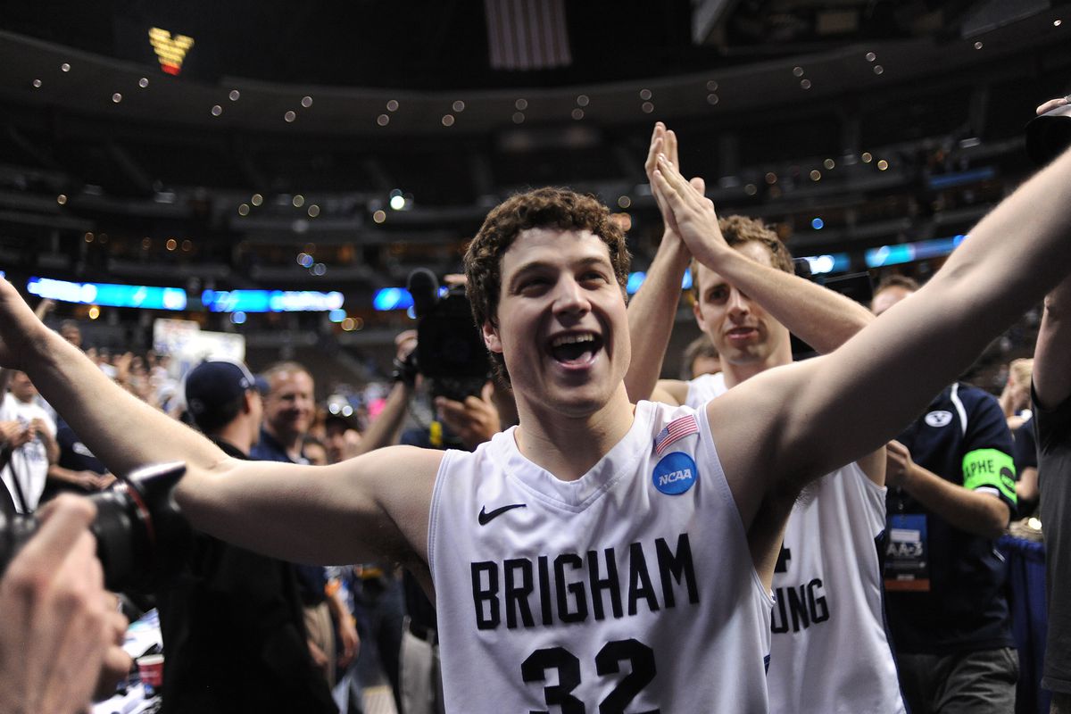 Jimmer Fredette leaves the court after BYU's win over Gonzaga in the Third Round of the NCAA Tournament on March 19, 2011 at the Pepsi Center in Denver, Colorado.