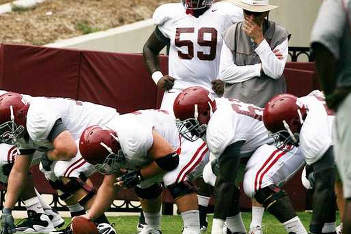 Assistant coach Joe Pendry works with the offensive line before scrimmaging at Bryant Denny Stadium on Saturday, Aug. 14, 2010. (Michelle Lepianka Carter | Tuscaloosa News)